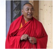Karma Senge Rinpoche in front of the main door of the shedra lhakang