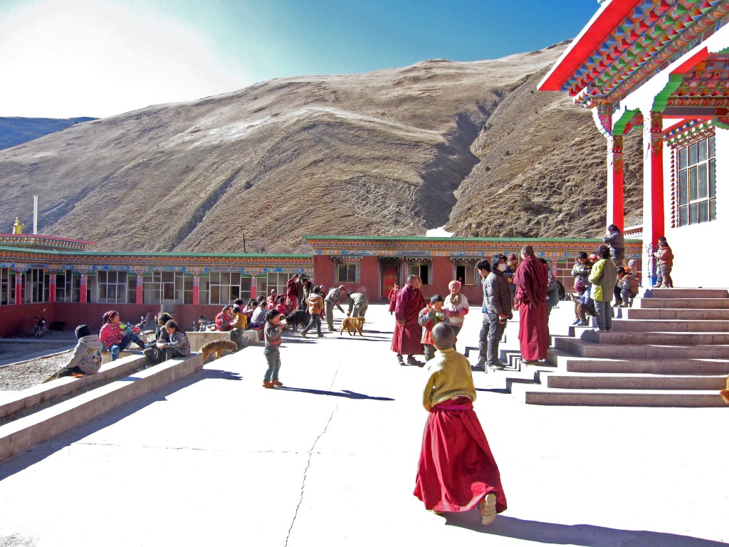 Shedra plaza with young monks and children in winter