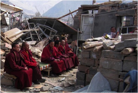 Trungpa XII Rinpoche, Aten Rinpoche and Surmang monks engage in Buddhist practices for those who died at this location-the bodies of the deceased are contained within the block enclosure April 2010